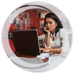 Eastern Savings Bank Business Banking. Woman business owner sitting with laptop reviewing account information