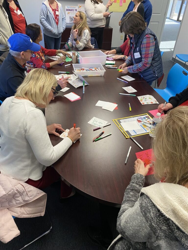 Eastern Savings Bank Volunteers write cards of encouragement at Baltimore Hunger Project February 2023