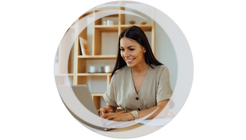 Account Access. Smiling female sitting at table in front of laptop