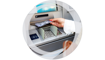 ATM Access. Hand removing cash dispensed at ATM