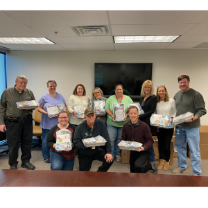 Group photo of associates completing birthday kit assembly for donation to Baltimore Hunger Project